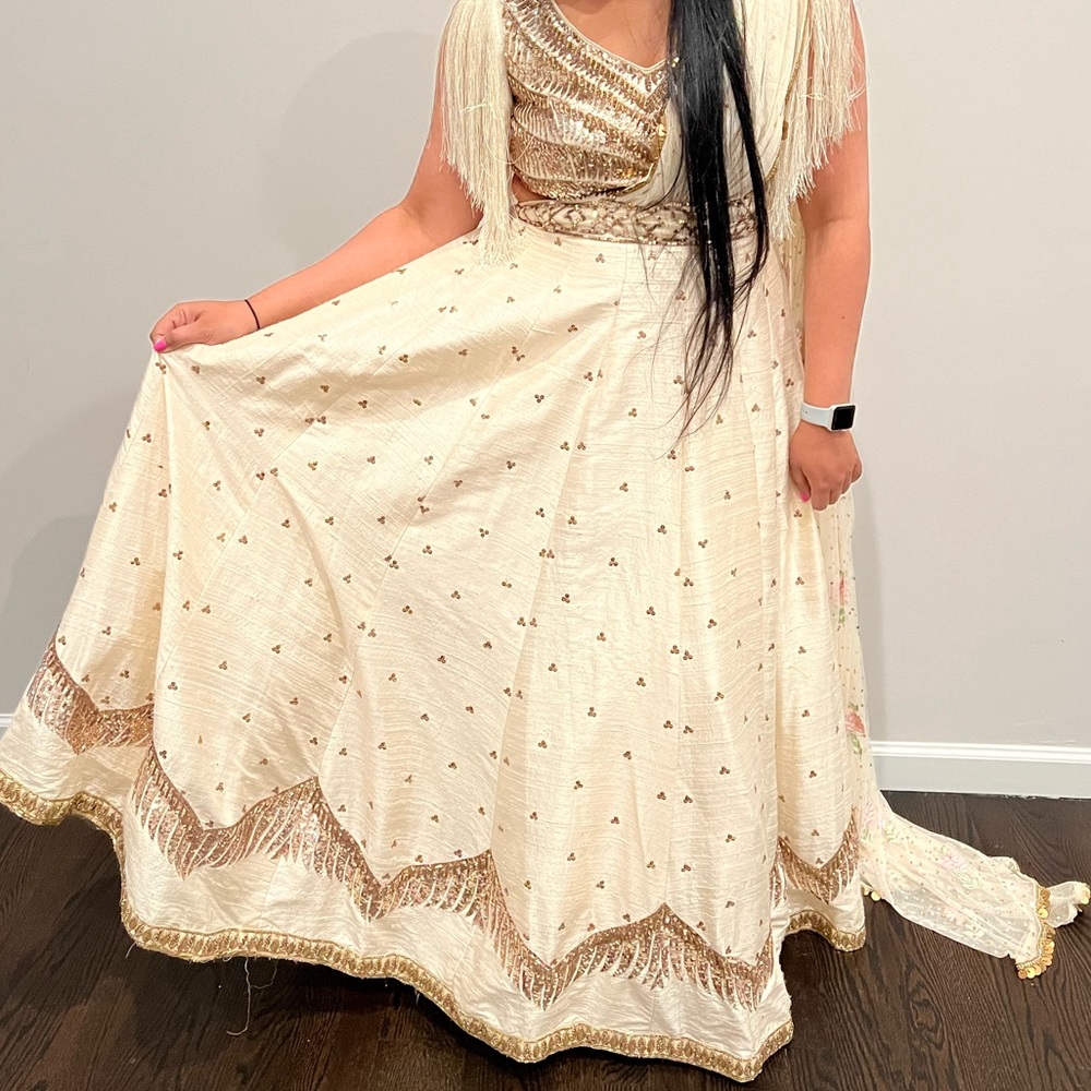 Beautiful ivory raw silk lehenga. Attached drape / trail..